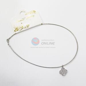 Silver four-leaf clover charm necklace
