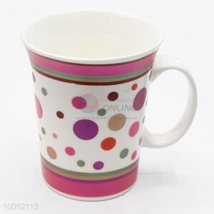 White ceramic cup with vertical stripes