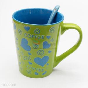 Green background with blue love ceramic cup