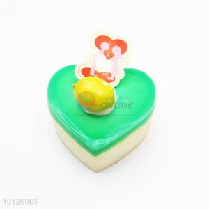 Green heart shaped cake refrigerator magnet