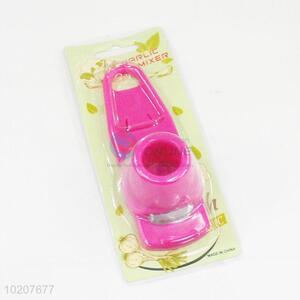 Household pink plastic garlic press