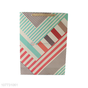 Low price geometric pattern cut paper bag portable gift bag