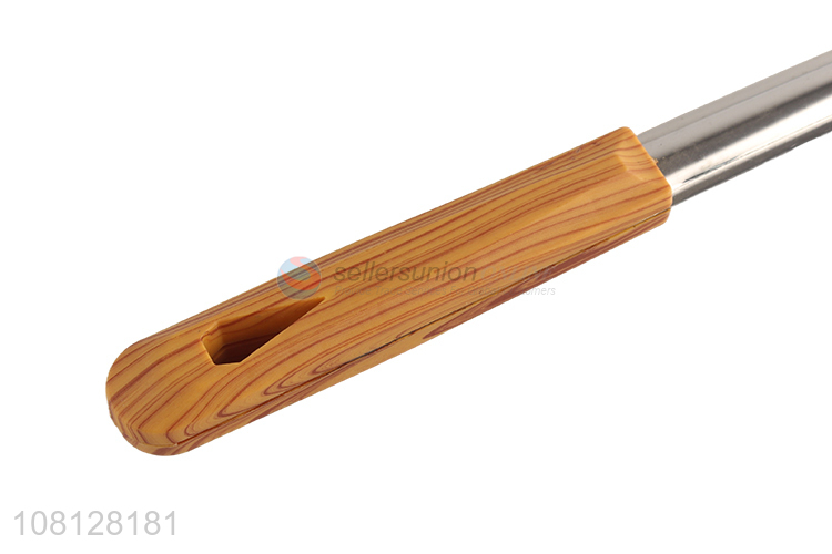 Good quality stainless steel slotted spatula with wooden handle