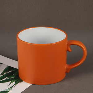 Low price orange ceramic water cup coffee cup with handle